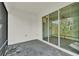 Screened patio with gray brick flooring and sliding glass doors leading indoors at 2458 Cliff Way, St Cloud, FL 34771