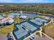 Overhead view featuring multiple tennis and pickleball courts next to the community pool at 2458 Cliff Way, St Cloud, FL 34771