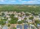 Aerial view of a residential neighborhood with established trees and houses with swimming pools at 2755 Abbey Ave, Orlando, FL 32833
