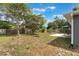 Large backyard featuring a patio area and grass at 2755 Abbey Ave, Orlando, FL 32833