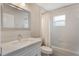 Well-lit bathroom with a vanity, mirror, and shower-tub combination at 2755 Abbey Ave, Orlando, FL 32833