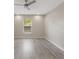 Empty bedroom with natural light featuring sleek floors and neutral walls at 2755 Abbey Ave, Orlando, FL 32833