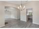 Open-concept living room boasts modern archways and neutral flooring and paint at 2755 Abbey Ave, Orlando, FL 32833