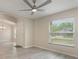 Bright living room showcasing neutral walls, sleek floors, and natural lighting at 2755 Abbey Ave, Orlando, FL 32833