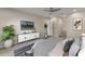 Comfortable main bedroom with stylish accents, ensuite bathroom and modern ceiling fan at 2755 Abbey Ave, Orlando, FL 32833