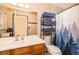 Bathroom featuring a vanity, mirror, toilet, and a shower with a decorative curtain at 3049 Condel Drive, Orlando, FL 32812