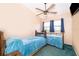 Bedroom with twin beds and bright blue accents, offering a cozy and inviting atmosphere at 3049 Condel Drive, Orlando, FL 32812