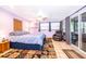 Bedroom with a sliding door to the outside features tile floors and a ceiling fan at 3049 Condel Drive, Orlando, FL 32812
