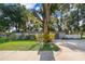 Traditional gray home with large tree in front yard at 3049 Condel Drive, Orlando, FL 32812