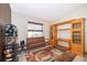 Inviting living area featuring a wooden bench, built-in shelving, and neutral tones at 3049 Condel Drive, Orlando, FL 32812