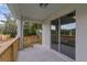 View of back porch with wooden railing at 31830 Sybil Ave, Sorrento, FL 32776