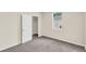 Bedroom with carpet, closet, and window at 31830 Sybil Ave, Sorrento, FL 32776
