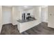 Modern kitchen with granite countertops, stainless steel appliances, and sleek white cabinets at 31830 Sybil Ave, Sorrento, FL 32776