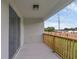 The patio includes sliding glass doors, a ceiling light, and a wooden railing at 31830 Sybil Ave, Sorrento, FL 32776