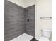 Close-up of the tiled stand-up shower with a grey tile surround at 31830 Sybil Ave, Sorrento, FL 32776