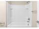 Bathroom shower features a showerhead with an all white tile surround at 31830 Sybil Ave, Sorrento, FL 32776