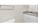 The bathroom has a granite vanity, updated fixtures, and tile flooring offering sophistication and style at 31836 Sybil Ave, Sorrento, FL 32776