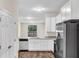Bright kitchen with granite countertops, stainless steel appliances, and a view of the backyard at 31836 Sybil Ave, Sorrento, FL 32776