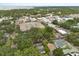 Expansive aerial view showcases downtown area with mature trees and a large parking garage at 40 W Smith St, Winter Garden, FL 34787