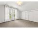 Bright attic with paneled walls, large windows, finished carpet, sliding closet doors, and unique ceiling at 40 W Smith St, Winter Garden, FL 34787