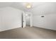 Spacious attic with carpet, paneled walls, a door to closet, and a unique ceiling at 40 W Smith St, Winter Garden, FL 34787