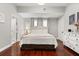 Bedroom with hardwood floors and white furniture in a home for sale at 40 W Smith St, Winter Garden, FL 34787