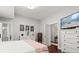 Bedroom with hardwood floors, white furniture, and ensuite bathroom in a home for sale at 40 W Smith St, Winter Garden, FL 34787