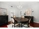 Elegant dining room featuring hardwood floors, neutral walls, stylish light fixture and a decorative painting at 40 W Smith St, Winter Garden, FL 34787