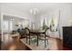 Bright dining area with hardwood floors, chandelier, open to the living area, and ample natural light at 40 W Smith St, Winter Garden, FL 34787