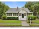 Charming two-story home with a well-manicured lawn, classic architecture, and inviting front entrance at 40 W Smith St, Winter Garden, FL 34787