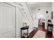 Hallway and stairway with hardwood floors and white molding in a home for sale at 40 W Smith St, Winter Garden, FL 34787