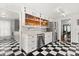 Bright kitchen with stainless steel appliances, hardwood floors, shaker cabinets, and an open design at 40 W Smith St, Winter Garden, FL 34787