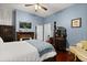 Bedroom with hardwood floors, ceiling fan, fireplace and period furnishings in a home for sale at 40 W Smith St, Winter Garden, FL 34787