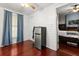 Sitting room with hardwood floors and a mini fridge off of bedroom in a home for sale at 40 W Smith St, Winter Garden, FL 34787