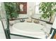 Bright bathroom featuring a tub, stand-up shower and a statue at 4201 Old Trafford Way, Orlando, FL 32810