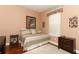 Cozy bedroom with a day bed, soft lighting, and hardwood floors at 4201 Old Trafford Way, Orlando, FL 32810