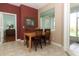 Dining nook with wood table and view to porch and hall at 4201 Old Trafford Way, Orlando, FL 32810