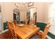 Cozy dining room featuring wood flooring, a chandelier, and elegant decor, perfect for Gathering meals at 4201 Old Trafford Way, Orlando, FL 32810