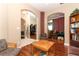 Spacious living room featuring hardwood floors, multiple seating areas, and elegant archways at 4201 Old Trafford Way, Orlando, FL 32810