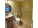 Bathroom with a shower-tub combo, vanity with sink, toilet, and a neutral color scheme at 440 Martigues Dr, Kissimmee, FL 34759