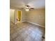 Comfortable bedroom with tile flooring, ceiling fan, en-suite bathroom, and neutral walls at 440 Martigues Dr, Kissimmee, FL 34759