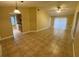 Open-concept living room featuring tile flooring, ceiling fan, and neutral paint colors at 440 Martigues Dr, Kissimmee, FL 34759