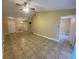 Spacious living room with tile flooring, ceiling fan, neutral walls, and ample natural light at 440 Martigues Dr, Kissimmee, FL 34759