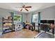 Functional bedroom setup with multiple desks, shelving, and plenty of natural light from two windows at 474 Overstreet Ave, Longwood, FL 32750