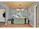 Cozy dining area with wooden floors, natural light, and a custom cabinet at 474 Overstreet Ave, Longwood, FL 32750