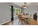 Bright dining room features a unique light fixture and backyard views through a large window at 474 Overstreet Ave, Longwood, FL 32750