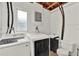 Bright laundry room features modern washer and dryer, a sink, and exposed ceiling at 474 Overstreet Ave, Longwood, FL 32750