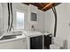 Functional laundry room with a washer, dryer, sink, and ample space for storage at 474 Overstreet Ave, Longwood, FL 32750