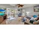 Comfortable living room featuring a large sectional sofa, wood floors, and view to outdoor patio at 474 Overstreet Ave, Longwood, FL 32750
