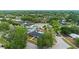 Beautiful aerial view of home with lush landscaping and a private backyard pool at 4804 Oakbrooke Pl, Orlando, FL 32812